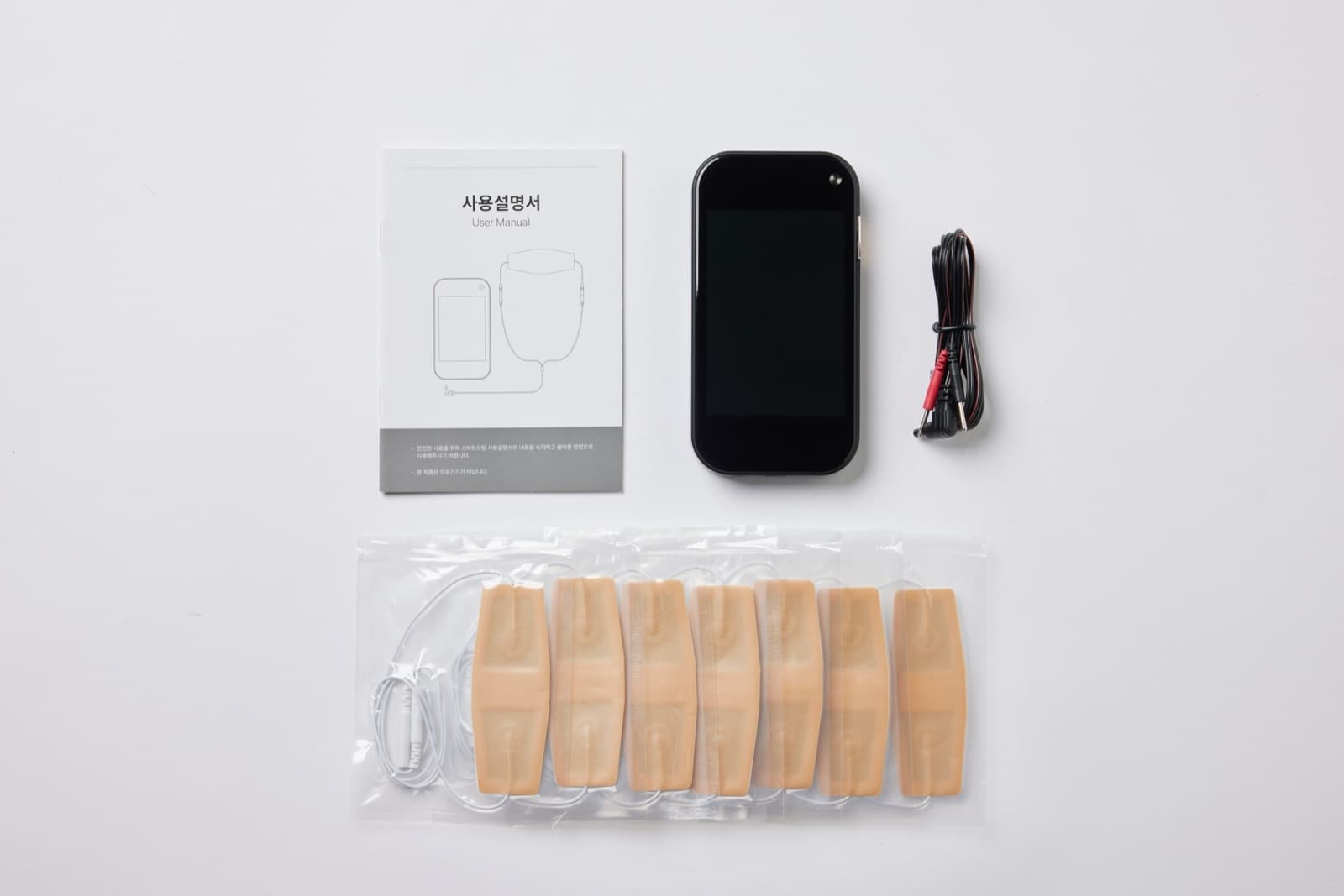 SmartDream 구성품 — 본체, EMS 케이블, 전극 패치 7매